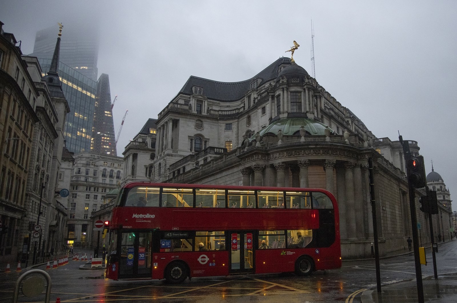 A bus passes the Bank of England amid the coronavirus pandemic, London, Britain, Feb. 15, 2021. (Photo by Getty Images)