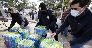 Donated water is distributed to residents, in Houston, Texas, U.S. Feb. 18, 2021. (AP Photo)