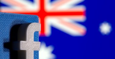 A 3D printed Facebook logo is seen in front of the displayed Australia's flag in this illustration photo taken Feb. 18, 2021. (Reuters Photo)