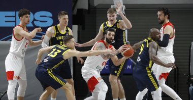 Turkey's and Sweden's players fight during a EuroBasket 2022 Group D qualifier basketball match between Turkey and Sweden, in Istanbul, Feb. 20, 2021. (AP Photo)