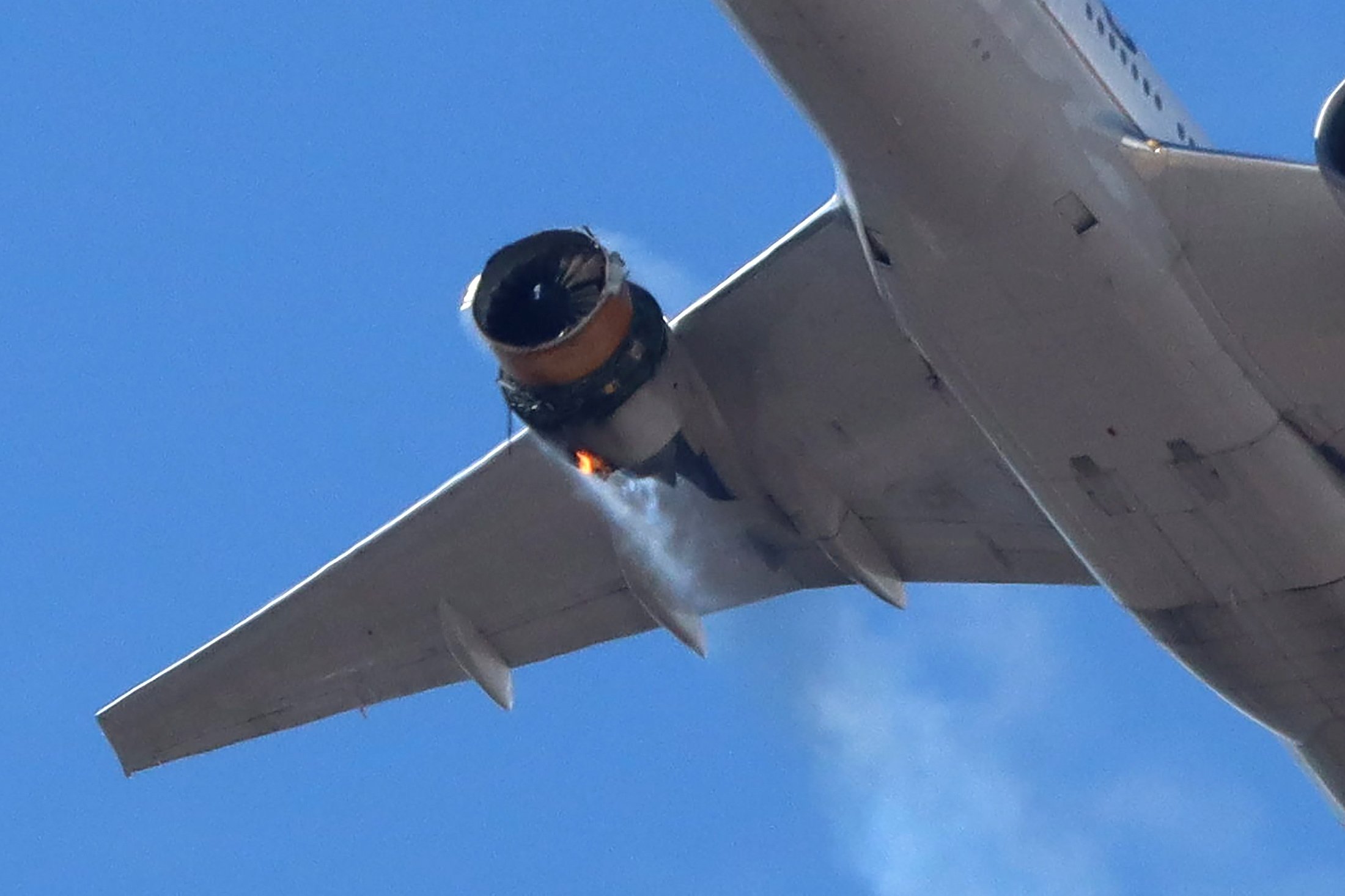 United Airlines flight UA328, carrying 231 passengers and 10 crew on board, returns to Denver International Airport with its starboard engine on fire after it sent a Mayday alert, over Denver, Colorado, U.S., Feb. 20, 2021. (Reuters Photo)