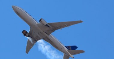 United Airlines flight UA328, carrying 231 passengers and 10 crew on board, returns to Denver International Airport with its starboard engine on fire after it sent a Mayday alert, over Denver, Colorado, U.S., Feb. 20, 2021. (Reuters Photo)