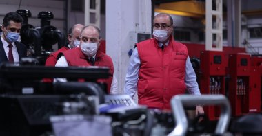 Industry and Technology Minister Mustafa Varank (L) tours Arken Generator facilities in Istanbul, Turkey, Feb. 21, 2021. (AA Photo)