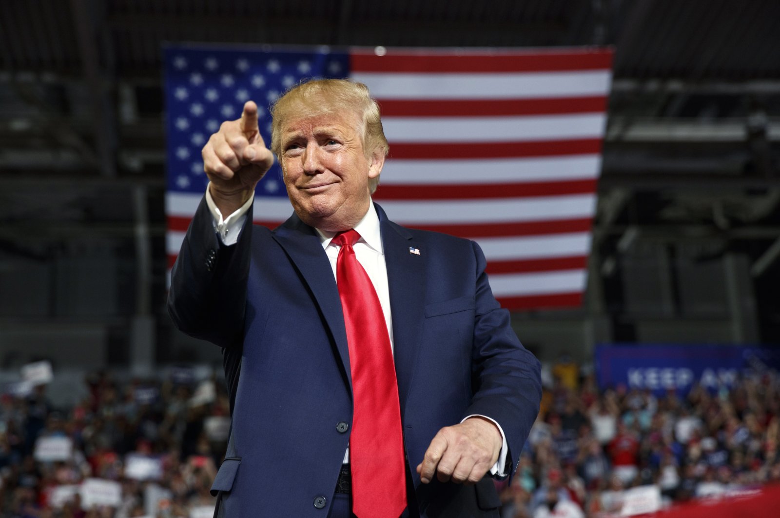 President Donald Trump gestures to the crowd as he arrives to speak at a campaign rally at Williams Arena in Greenville, U.S., July 17, 2019. (AP Photo)
