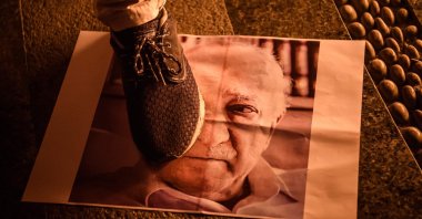 A protestor walks on a poster of U.S.-based Fetullah Gülen, the leader of the Gülenist Terror Group (FETÖ), during a demonstration, Istanbul, Turkey, July 18, 2016. (AFP Photo)