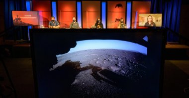 The first high-resolution, color image to be sent back by the Hazard Cameras (Hazcams) on the underside of NASA’s Perseverance Mars rover after its landing is shown during a NASA Perseverance rover initial surface checkout briefing at NASA's Jet Propulsion Laboratory in Pasadena, California, U.S. Feb.19, 2021. (NASA/Bill Ingalls/Handout via Reuters)