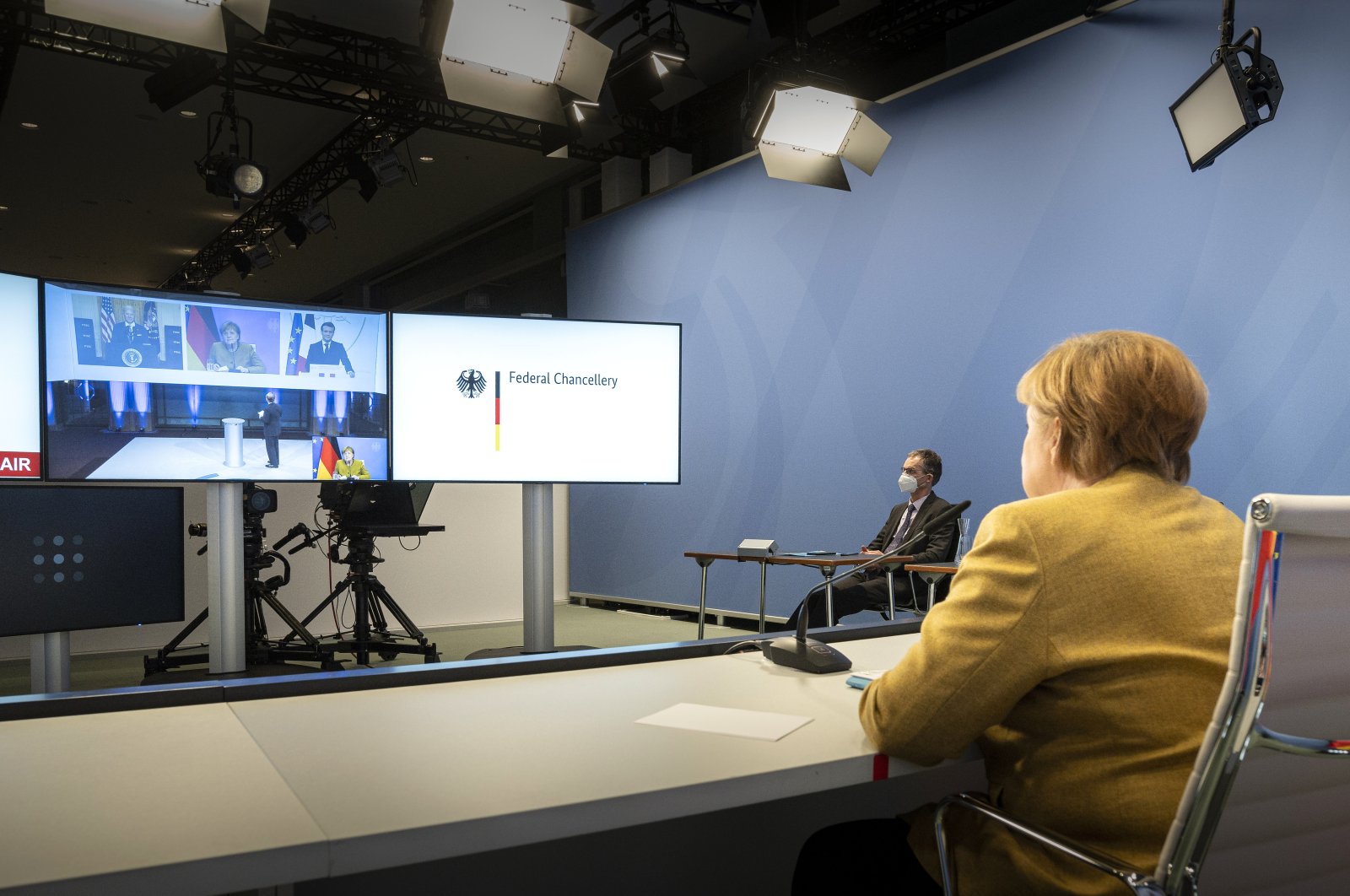German Chancellor Angela Merkel attends the online Munich Security Conference with U.S. President Joe Biden and French President Emmanuel Macron (on the screen), Berlin, Germany, Feb. 19, 2021. (Photo by Getty Images)