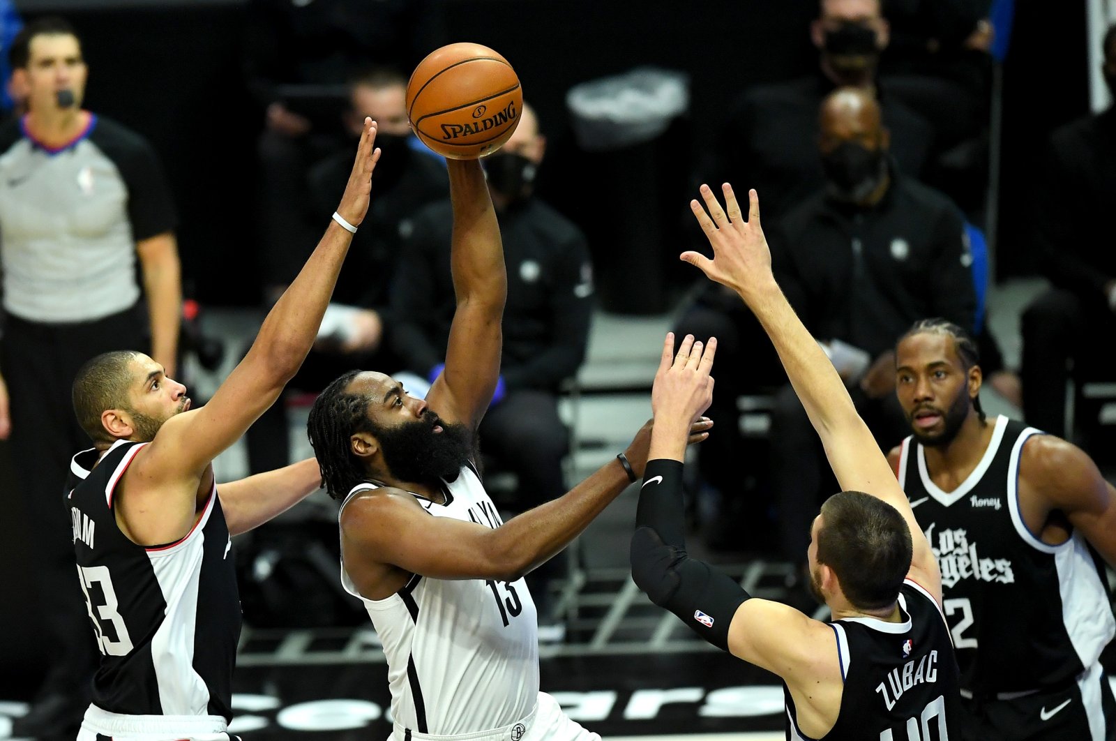 Brooklyn Nets guard James Harden (C) shoots as Los Angeles Clippers forward...