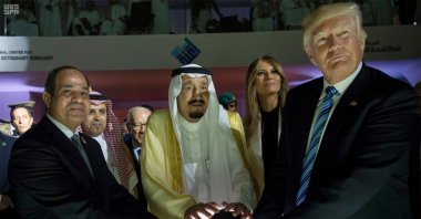 From left to right, Egyptian President Abdel-Fattah el-Sissi, Saudi King Salman, then U.S. First Lady Melania Trump and then U.S. President Donald Trump put their hands on an illuminated globe during the inauguration ceremony of the Global Center for Combating Extremist Ideology, Riyadh, Saudi Arabia, May 21, 2017. (AP Photo)