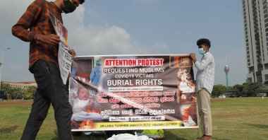 Members of Sri Lanka Thawheed Jamaath, a Muslim organization, display a banner demanding burial rights for Muslims who die of COVID-19, in Colombo, Sri Lanka, Dec. 16, 2020. (AP Photo)