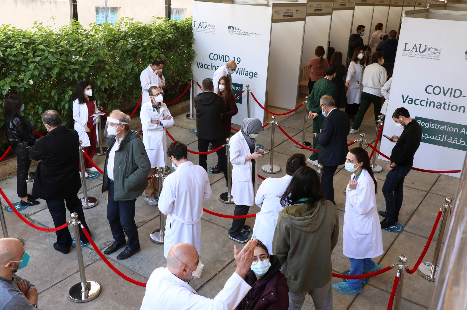Health care workers wait to receive the Pfizer/BioNTech COVID-19 vaccine during a coronavirus vaccination campaign at Lebanese American University Medical Center-Rizk Hospital in Beirut, Lebanon, Feb. 16, 2021. (Reuters Photo)
