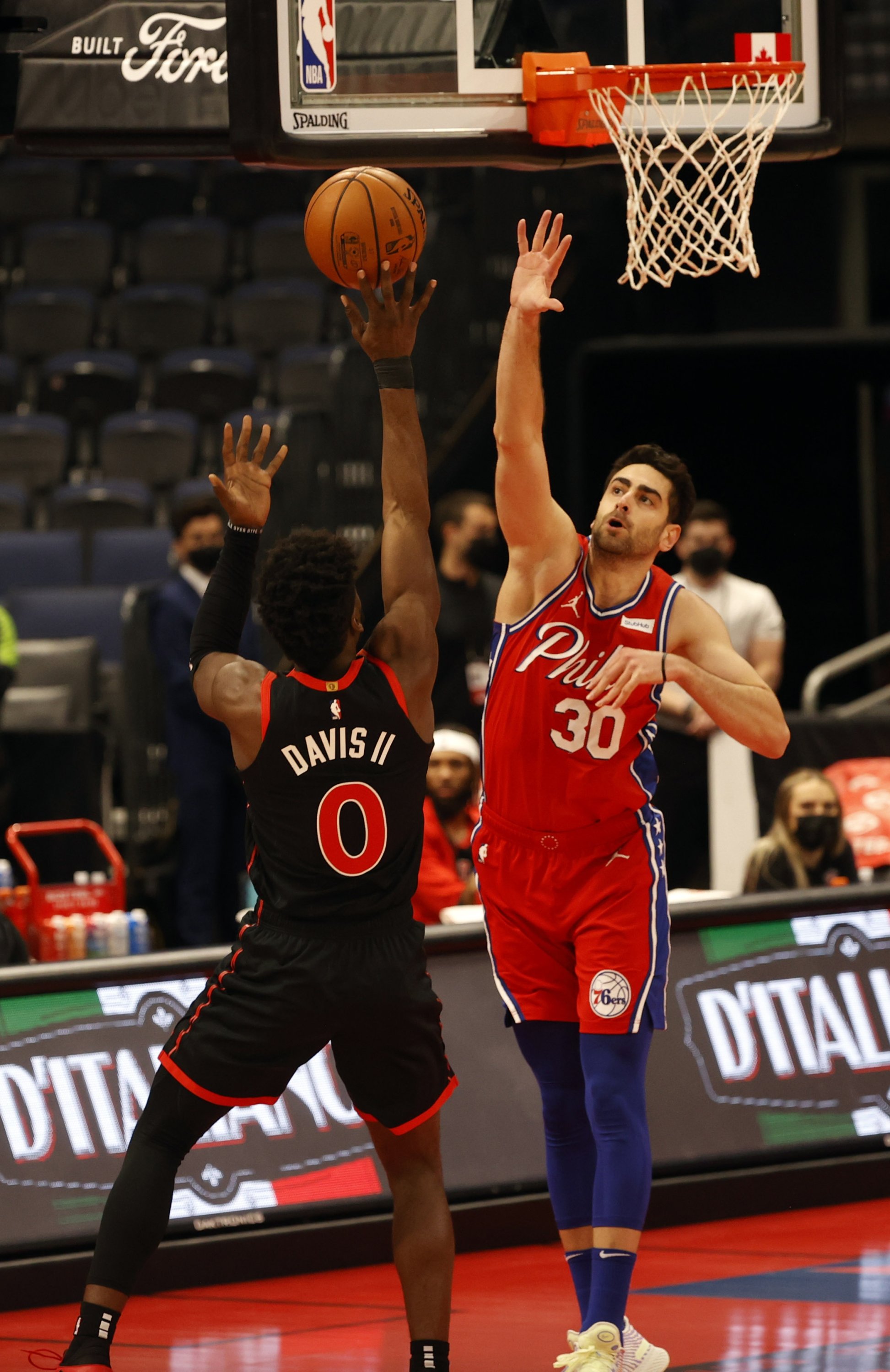 Toronto Raptors guard Terence Davis (L) shoots as Philadelphia 76ers guard Furkan Korkmaz (R) attempts to defend at Amalie Arena, Tampa, Florida, Feb 23, 2021. (Reuters Photo)