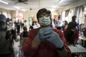 A pharmacist prepares the Johnson & Johnson COVID-19 vaccine to administer to health care workers at the government hospital in Klerksdorp, South Africa, Feb. 18, 2021. (AP Photo/Shiraaz Mohamed)