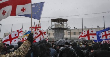 People protest during a rally in support of Georgian opposition leader Nika Melia in front of a prison in Rustavi, about 20 kilometers (12.4 miles) from Tbilisi, Georgia, Feb. 24, 2021. (EPA Photo)
