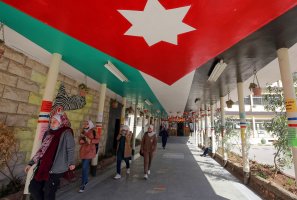 Jordanian pupils return to school for the first time in nearly a year, in the capital Amman, Jordan, Feb. 7, 2021. (Photo by Khalil MAZRAAWI / AFP)
