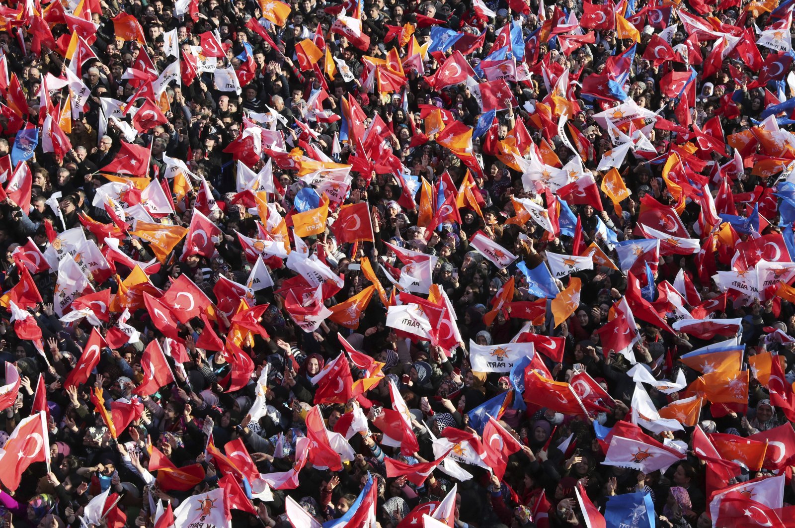 Supporters of Turkey's President Recep Tayyip Erdoğan's ruling Justice and Development Party (AK Party) wave Turkish and party flags during his speech at a rally in Bartın, Turkey, March 4, 2019. (Presidential Press Service via AP, Pool)