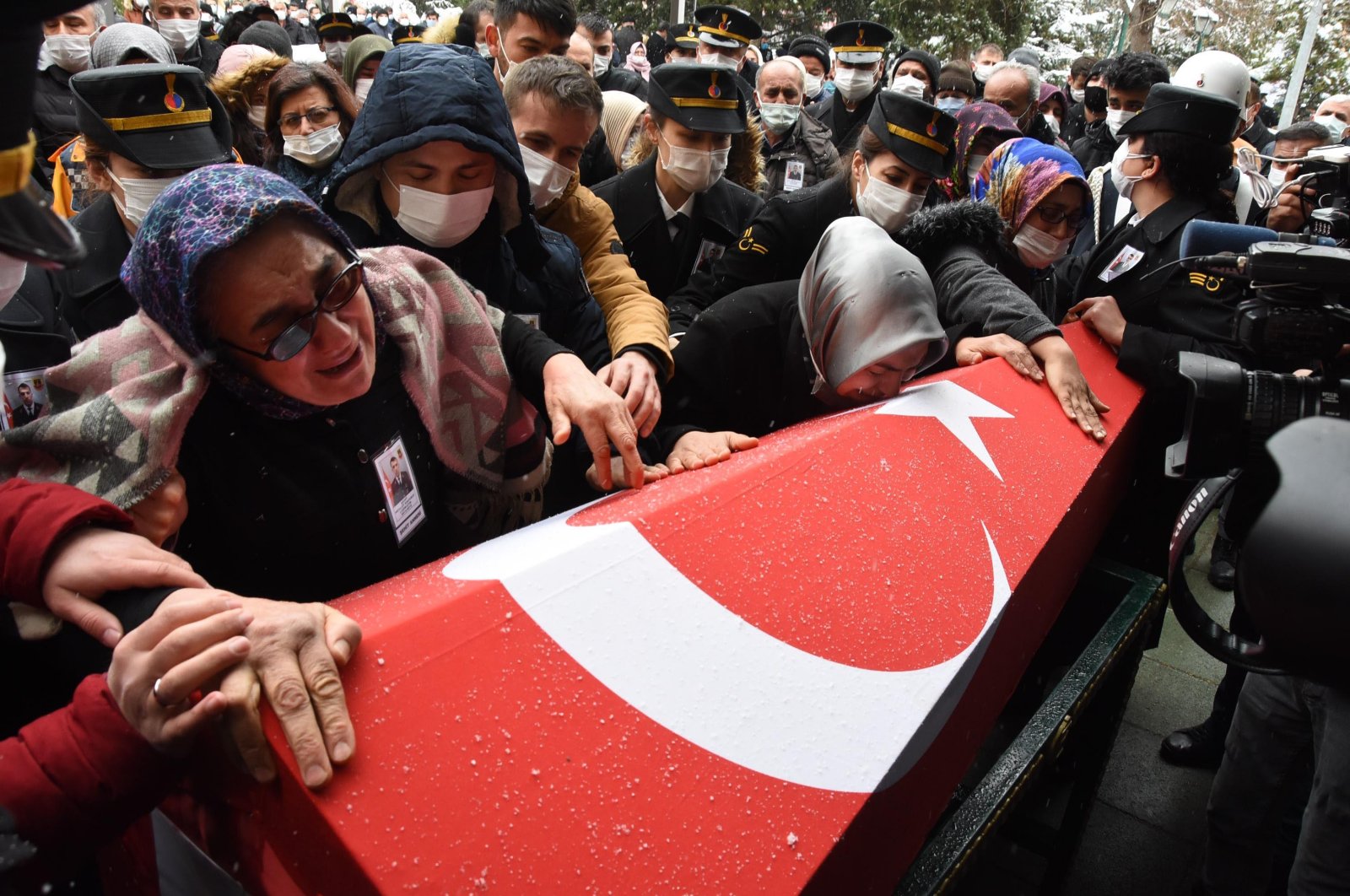 People mourn during the funeral of the Gerndermarie Specialized Sergeant Mevlüt Kahveci who the PKK terrorists killed in northern Iraq's Gara, Feb.18, 2021. (DHA) 