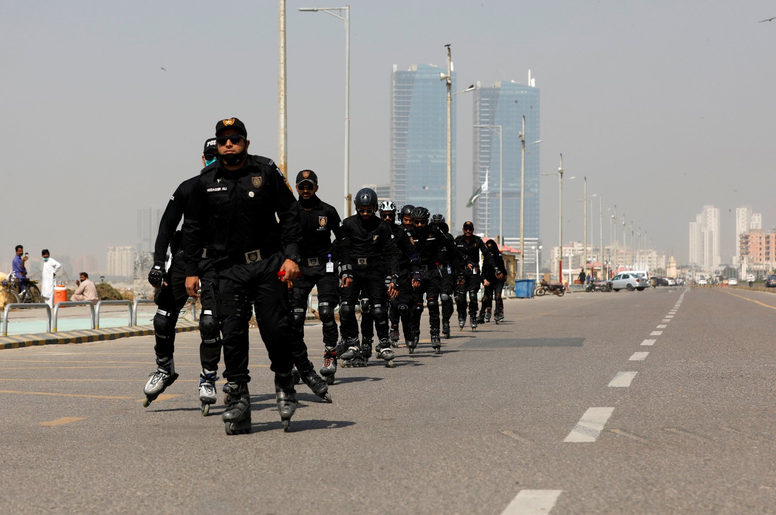 Special Security Unit (SSU) police members rollerblade during practice along the seafront in Karachi, Pakistan, Feb. 19, 2021. (Reuters Photo)