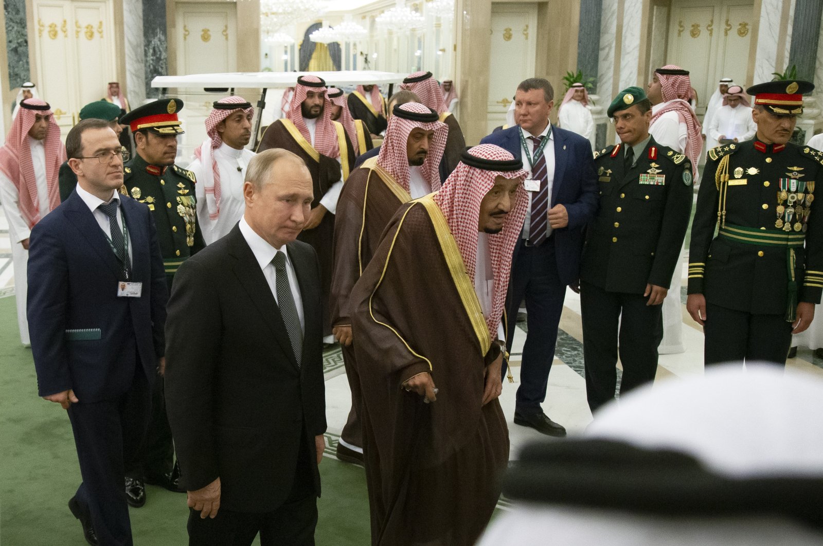 Russian President Vladimir Putin (2nd L) and Saudi King Salman (C) arrive for talks in Riyadh, Saudi Arabia, Oct. 14, 2019. (AP Photo)
