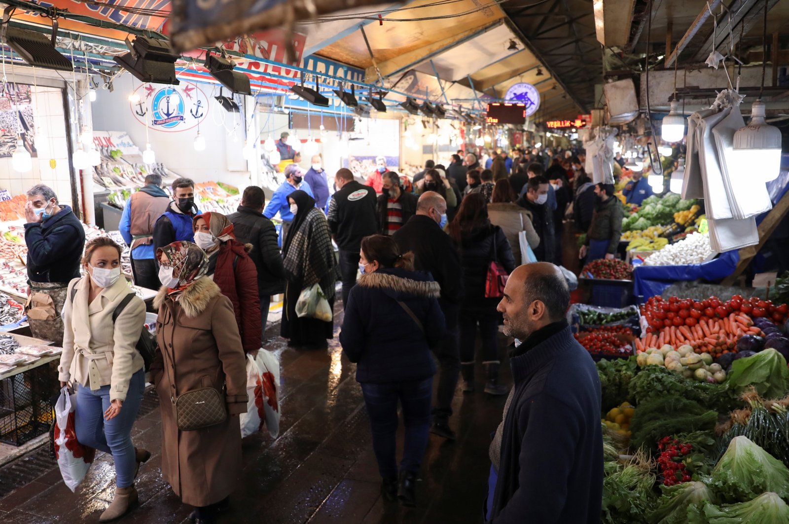 People wearing protective masks shop at a local market, amid the coronavirus outbreak, in the capital Ankara, Turkey, Feb. 24, 2021. (Reuters Photo)