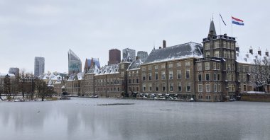The frozen Hofvijver pond is seen outside the Dutch parliament buildings in The Hague, Netherlands, Tuesday, Feb. 9, 2021. (AP Photo)
