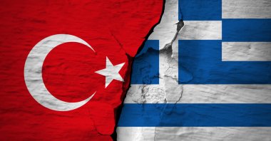 In this illustration, the flags of Turkey and Greece are seen on a cracked concrete wall. (Photo by Shutterstock)