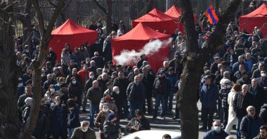 Opposition supporters rally outside the National Assembly building to demand Prime Minister Nikol Pashinian's resignation over his handling of last year's war with Azerbaijan, in Yerevan, Armania, Feb. 26, 2021. (AFP Photo)