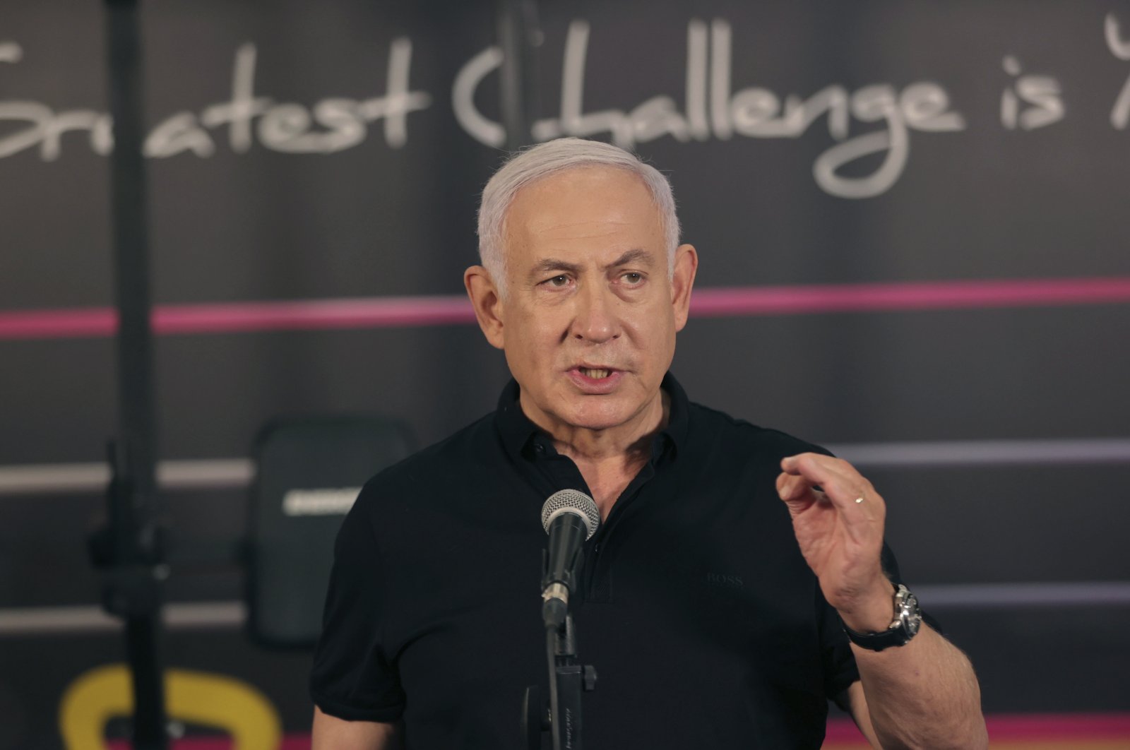 Israeli Prime Minister Benjamin Netanyahu talks to the media during a visit to the Fitness gym ahead of the re-opening of the branch in Petah Tikva, Israel, Feb. 20, 2021. (AP Photo)