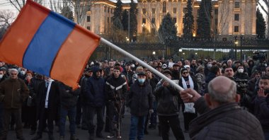 Opposition supporters rally outside the National Assembly building to demand Prime Minister Nikol Pashinian's resignation over his handling of last year's war with Azerbaijan, in Yerevan on Feb. 26, 2021. (AFP Photo)