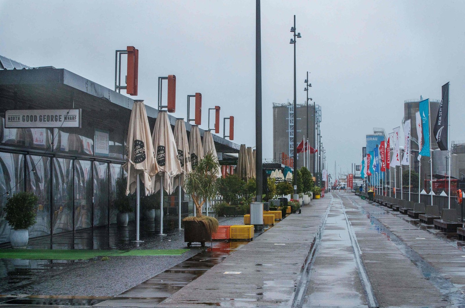 The restaurant and bar area of Wynyard Quarter, normally busy with America Cup crowds, is deserted as the city enters a level 3 lockdown in Auckland, New Zealand, on Feb.15, 2021. (AFP Photo)