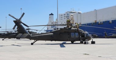 U.S. Army troops assemble and fix their helicopters after unloading them from the ARC ship at the port of Alexandroupoli (Dedeağaç), Greece, July 23, 2020. (Photo by Getty Images)