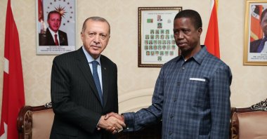 President Recep Tayyip Erdoğan (L) and Zambian President Edgar Lungu shake hands before a meeting in Lusaka, Zambia, July 28, 2018.