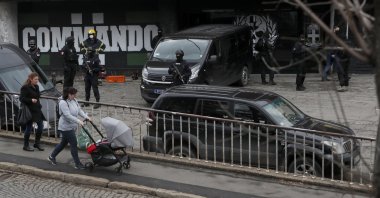 Serbian police officers guard Partizan stadium during a raid, in Belgrade, Serbia, Thursday, Feb. 4, 2021. (AP Photo)