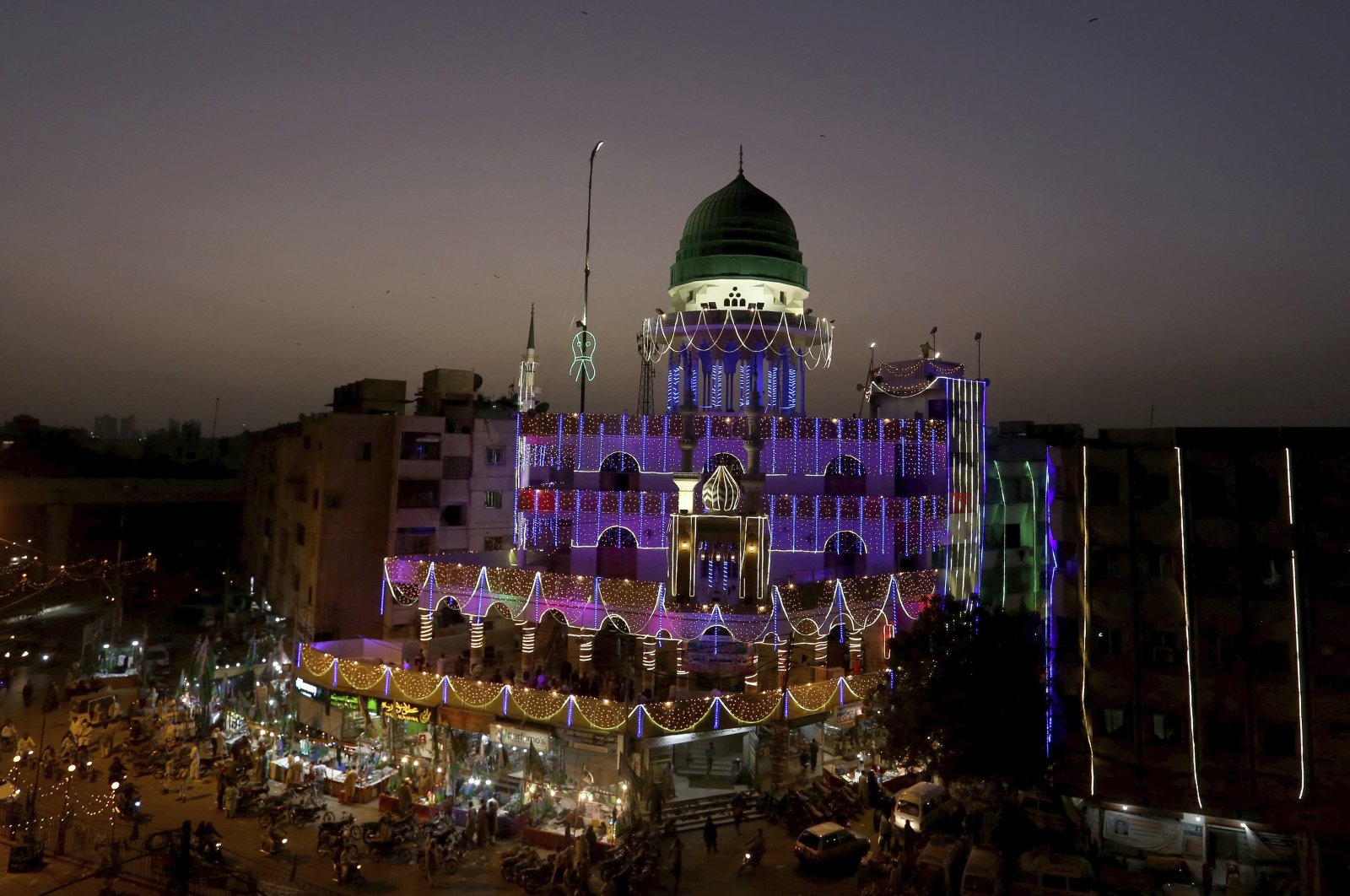 A mosque is decorated with lights for the Mawlid an-Nabi holiday celebrating the birthday of the Prophet Muhammad, in Karachi, Pakistan, Oct. 25, 2020. (AP Photo)