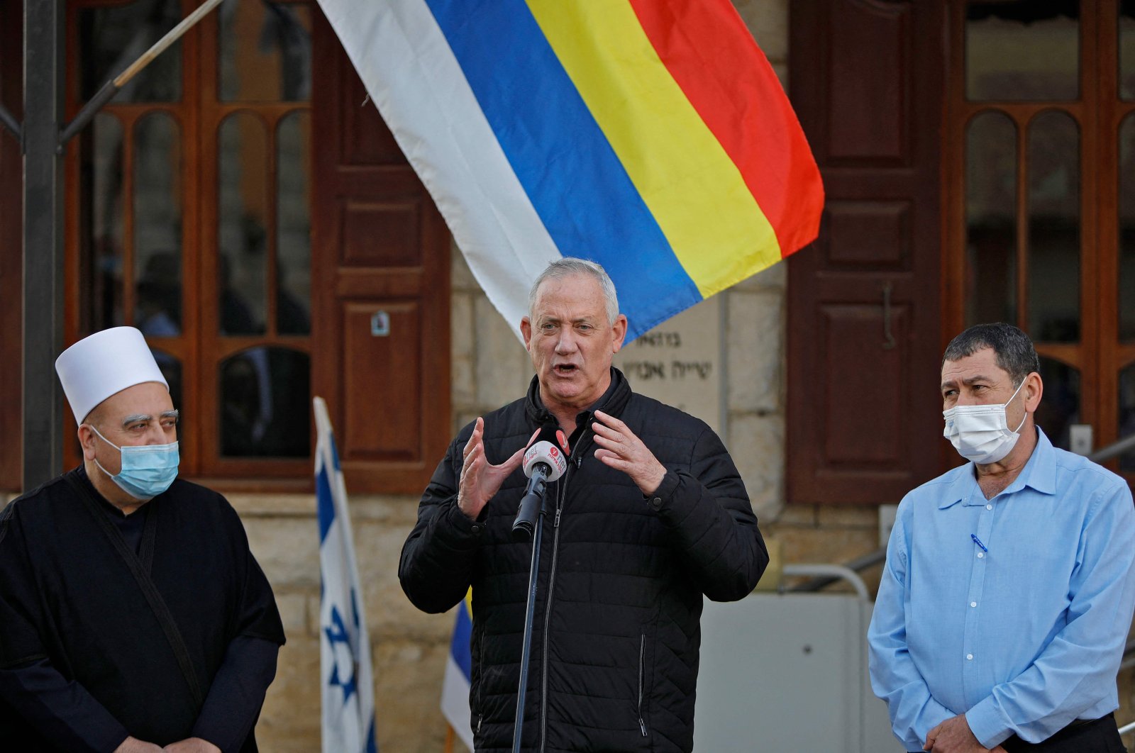 Defence Minister Benny Gantz (C), the leader of the Kahol Lavan (Blue and White) party, speaks during a visit to the Druze village of Julis, northern Israel, Feb. 23, 2021. 