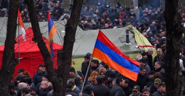Opposition supporters rally outside the National Assembly building to demand Prime Minister Nikol Pashinian's resignation over his handling of last year's war with Azerbaijan, in Yerevan on March 1, 2021. (AFP Photo)