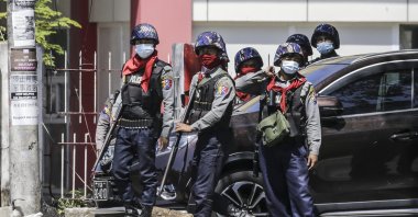 Anti-riot police officers secure the area after dispersing protesters during an anti-coup protest following the military crackdown in Yangon, Myanmar, March 1, 2021. (EPA Photo)