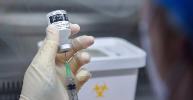 A nurse fills a syringe with a dose of the Pfizer-BioNTech COVID-19 vaccine at the National Medical Center in Seoul, South Korea, Feb. 27, 2021. (EPA Photo)
