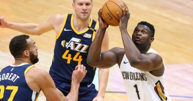 New Orleans Pelicans' Zion Williamson (R) looks to shoot against Utah Jazz's Rudy Gobert (L) and Bojan Bogdanovic (C) during an NBA game at the Smoothie King Center, New Orleans, Louisiana, March 01, 2021. (AFP Photo)