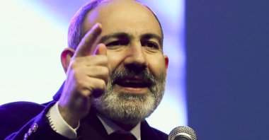Armenian Prime Minister Nikol Pashinian gestures while addressing his supporters during a rally in his support in the center of Yerevan, Armenia, Monday, March 1, 2021. (AP Photo)