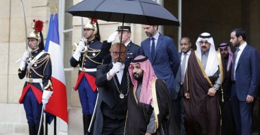 Saudi Arabia's Crown Prince M. bin Salman, center, walks out after his meeting with then-French Prime Minister Edouard Philippe, center back, in Paris, Monday April 9, 2018. (AP File Photo)