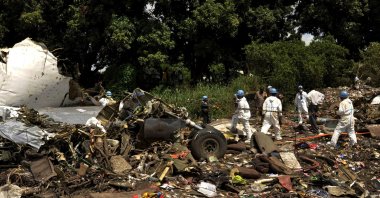 United Nations aviation experts investigate the wreckage of a cargo airplane that crashed after take off near Juba Airport in South Sudan on Nov. 5, 2015. (Reuters File Photo)