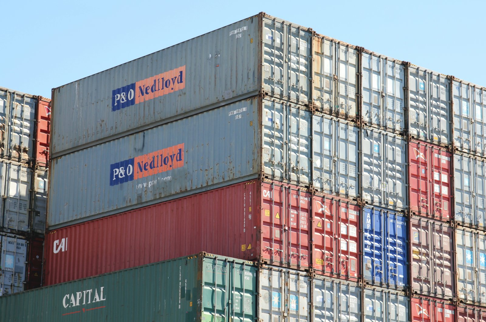 Shipping containers of CAI, Capital and the former Anglo-Dutch container shipping line P and O Nedlloyd stacked at the Port of Hamburg, Germany, June 1, 2020. (Shutterstock Photo)