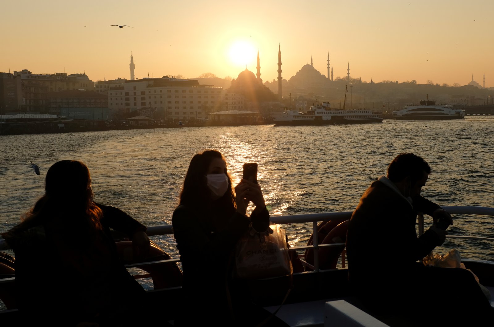People travel on a ferry over the Bosporus amid the COVID-19 outbreak in Istanbul, Turkey, Feb. 23, 2021. (Reuters Photo)