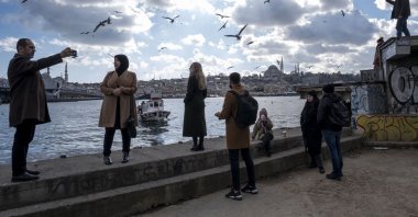 People spending time at the Karaköy seaside amid the pandemic, Istanbul, Turkey, Feb. 28, 2021. (Photo by Getty Images)