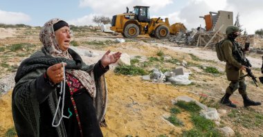 A Palestinian woman reacts as Israeli forces demolish her house near Hebron in the Israeli-occupied West Bank, March 2, 2021. (Reuters Photo)