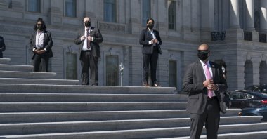 U.S. Capitol Police protective agents stand watch as Speaker of the House Nancy Pelosi, D-Calif., and other lawmakers hold a news event on the steps of the House of Representatives at the Capitol in Washington, Wednesday, March 3, 2021. (AP Photo)