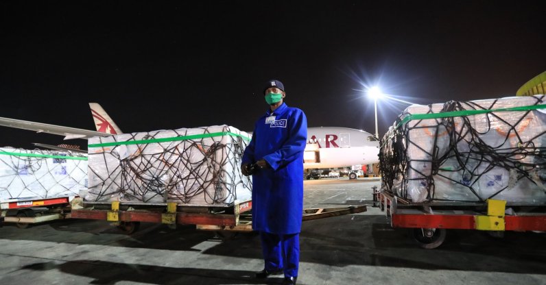 A Kenya police officer (C) stands guard next to some of the first batch of 1.02 million doses of Oxford/AstraZeneca COVID-19 vaccines after their arrival at the Jomo Kenyatta International Airport (JKIA), in Nairobi, Kenya, March 3, 2021. (EPA Photo)