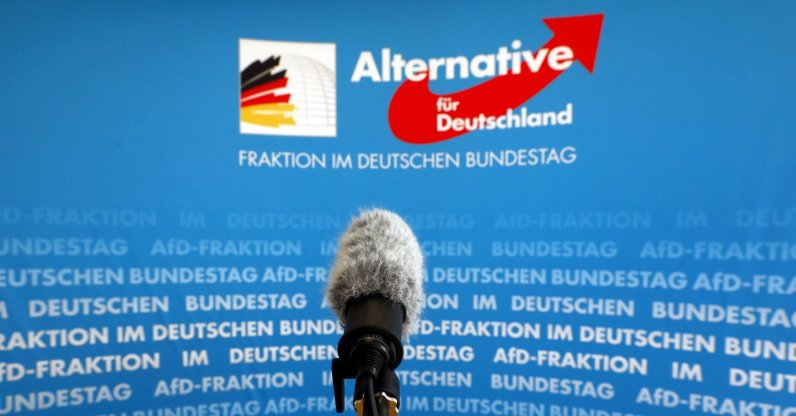 A microphone stands in front of an AfD (Alternative fuer Deutschland) logo on the press wall of the German Bundestag in Berlin, Germany, March 12, 2020. (Reuters Photo)