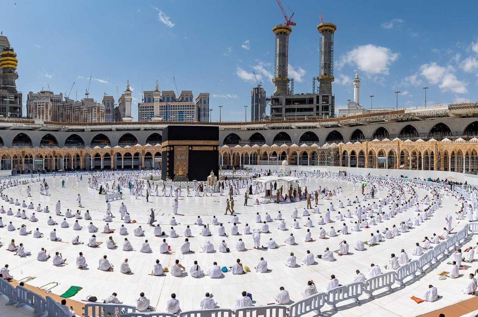 Muslims perform socially distanced Friday prayers as they arrive to perform Umrah in the Grand Mosque in the holy city of Mecca, Saudi Arabia, Feb. 26, 2021. (Saudi Press Agency via Reuters)
